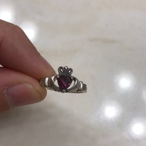 Silver ring with purple gemstone
